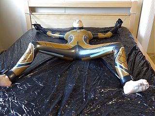 Latex Danielle is attached to the bed and masturbated with the massage vibrator. Full video